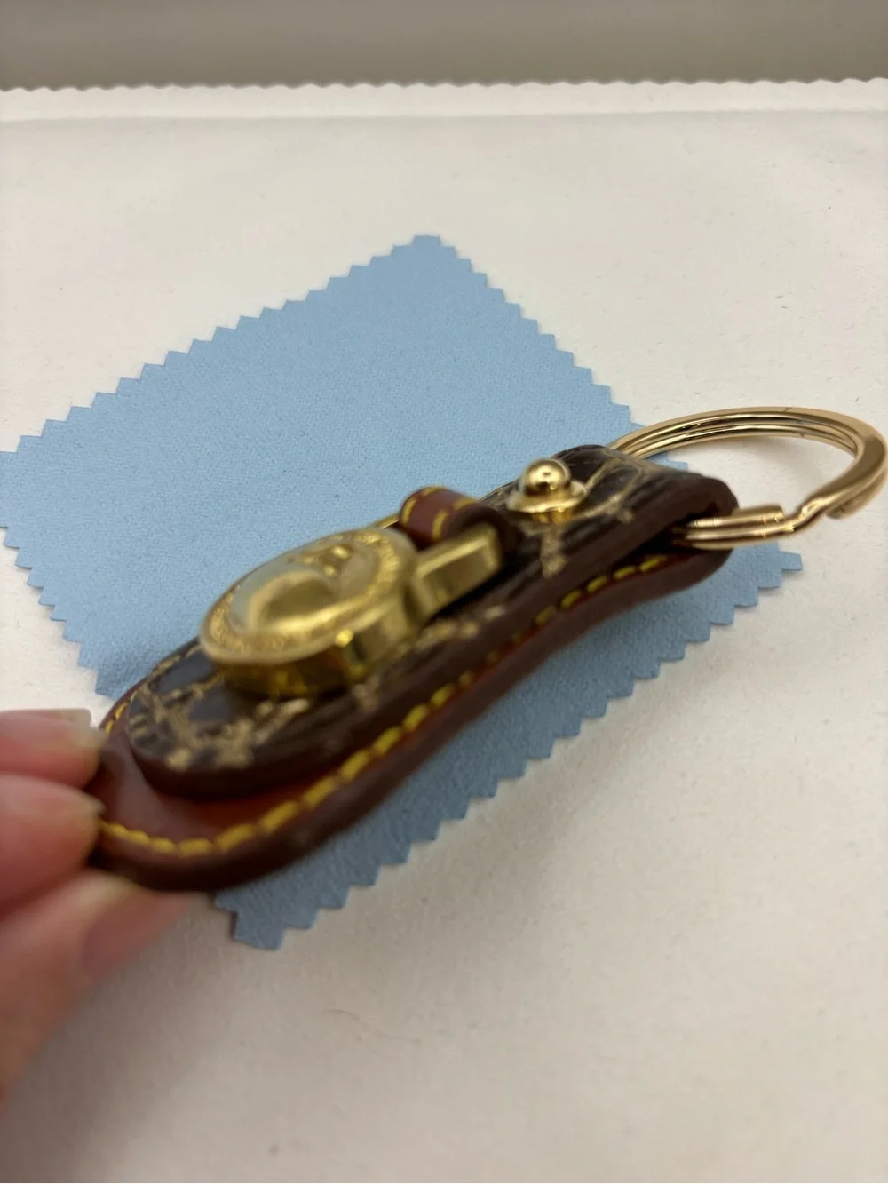 Dooney & Bourke Brown Leather Keychain with Gold Medallion